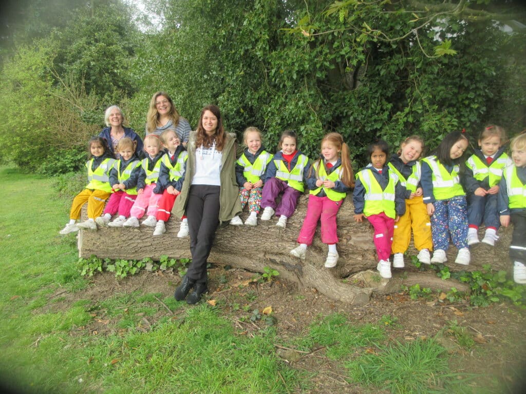 students sat on a log