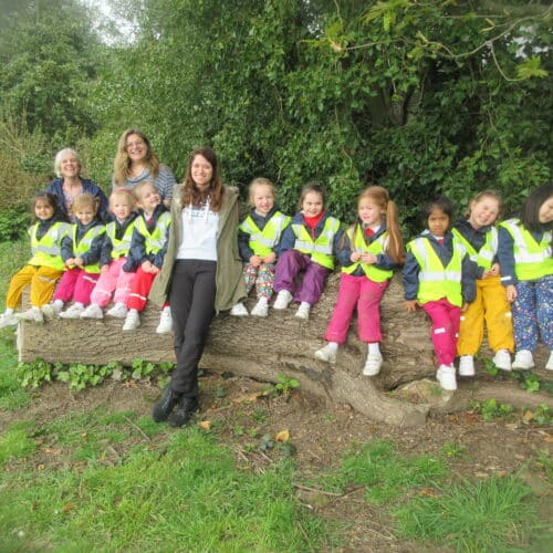 students sat on a log