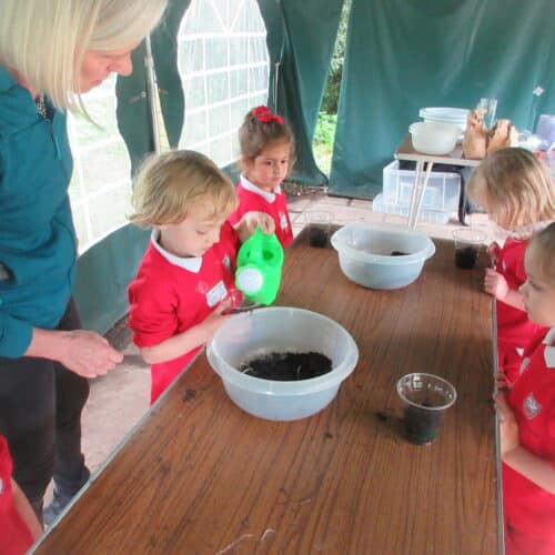 students mixing soil in a bowl