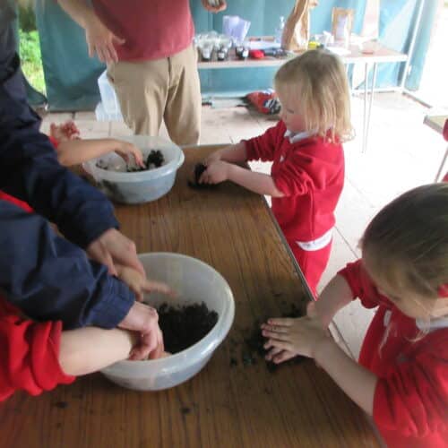 students mixing soil in a bowl