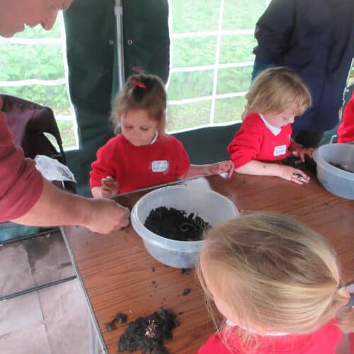 students mixing soil in a bowl