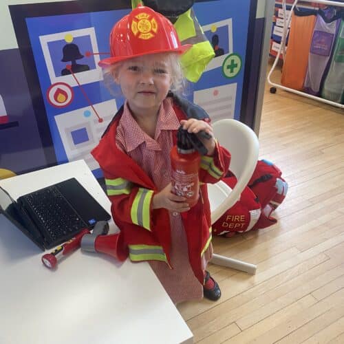 student dressed as a fire fighter